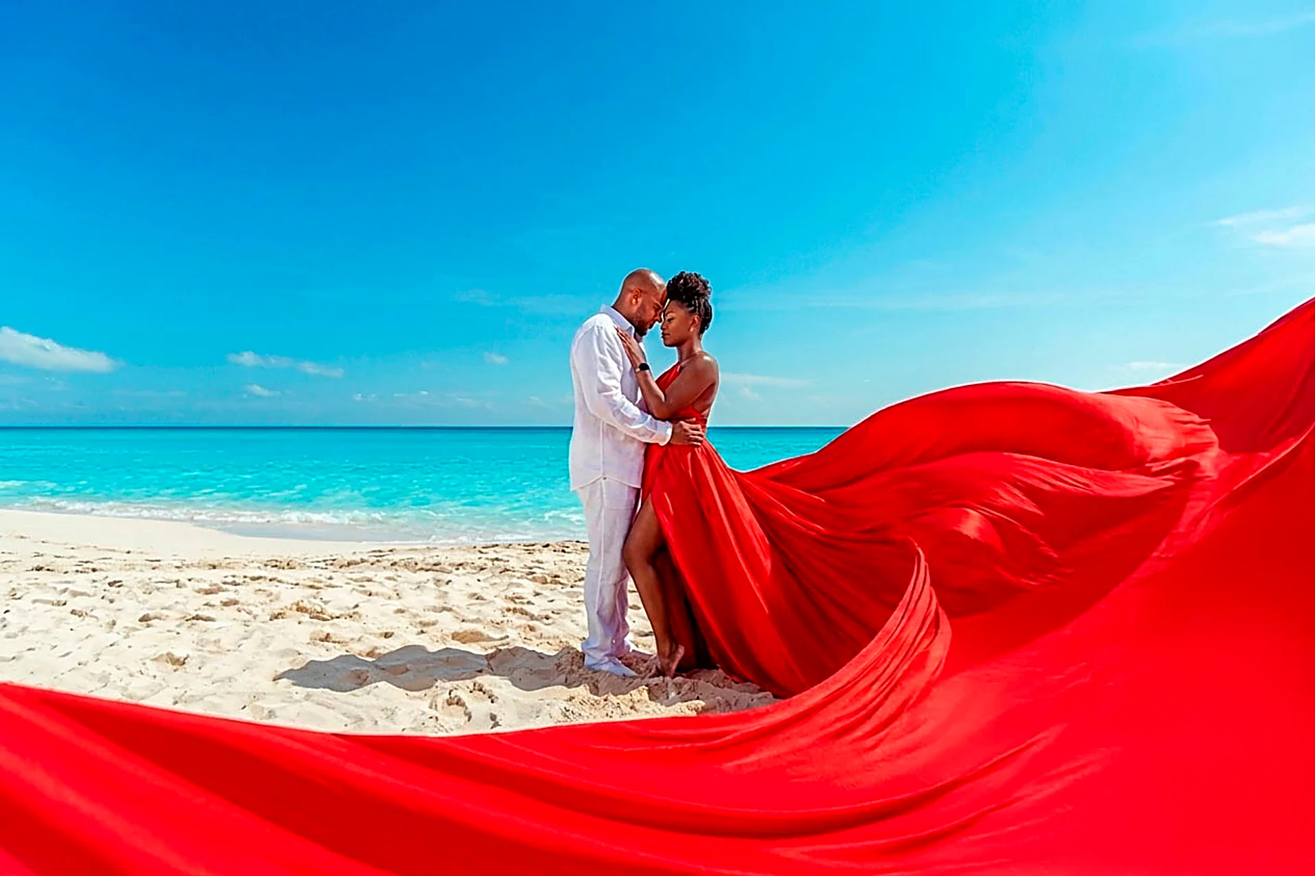 Flying Dress photoshoot on the turquoise Caribbean beach of Cancun, Mexico
