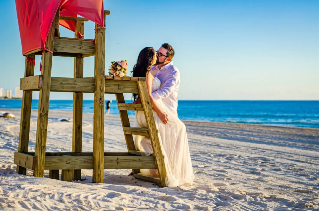 Couple embracing at the water’s edge during a private early-morning photo session in Playa del Carmen